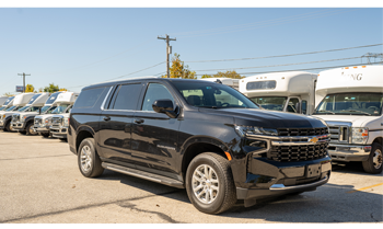 Black SUVs on a highway