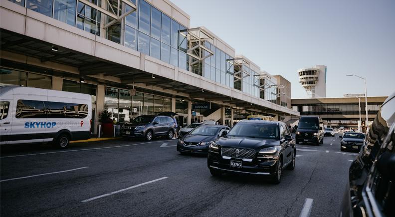 Black SUVs on a highway