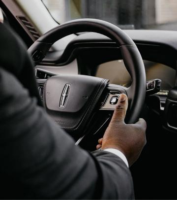 Black SUVs on a highway