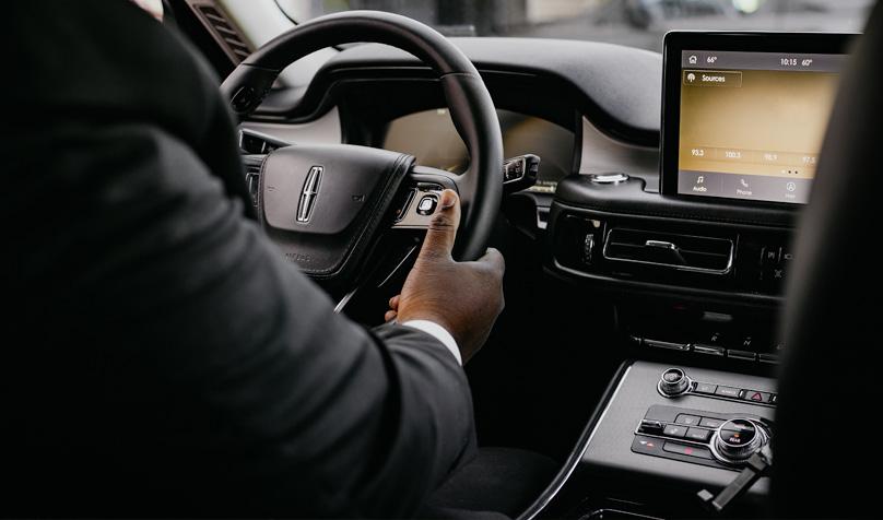 Black SUVs on a highway