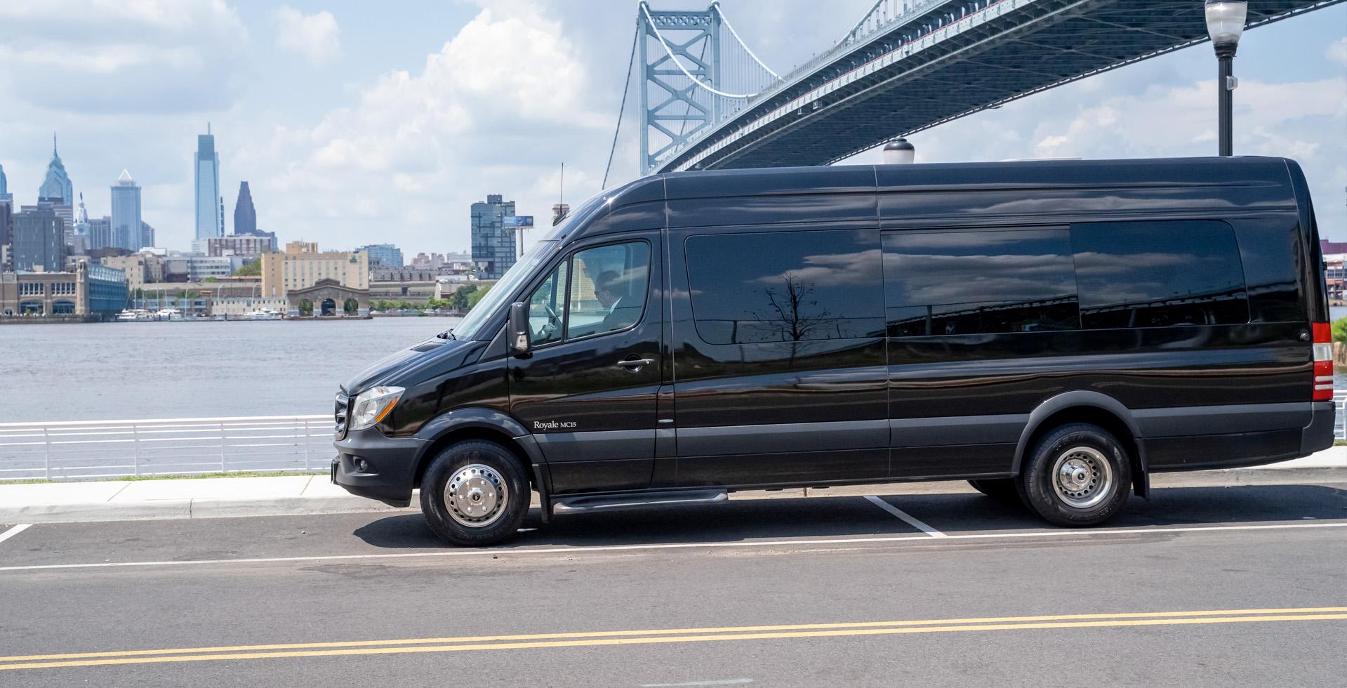 Black van driving near the Ben Franklin bridge on the New Jersey side