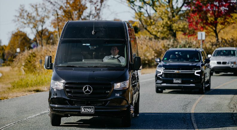 Van and two other cars on a road