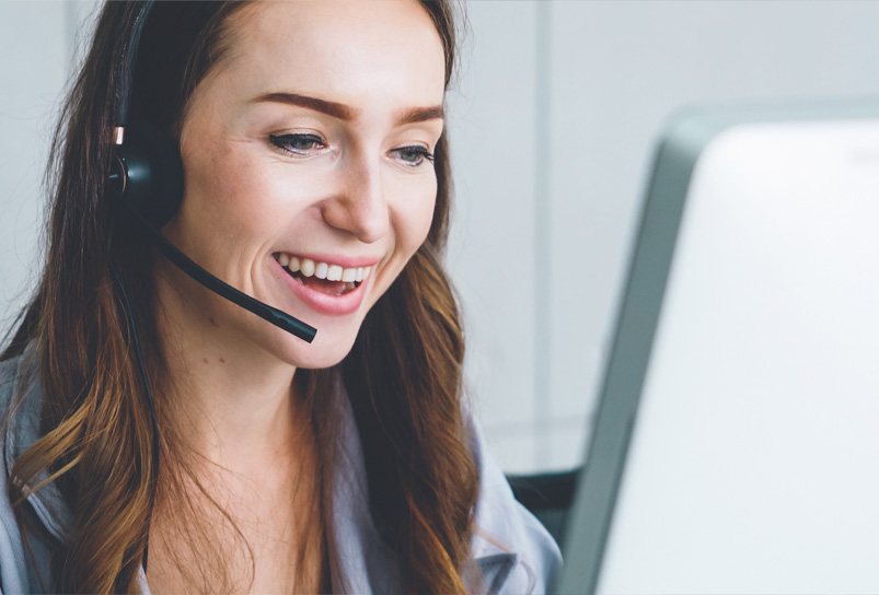 Account manager at a desk looking at a computer